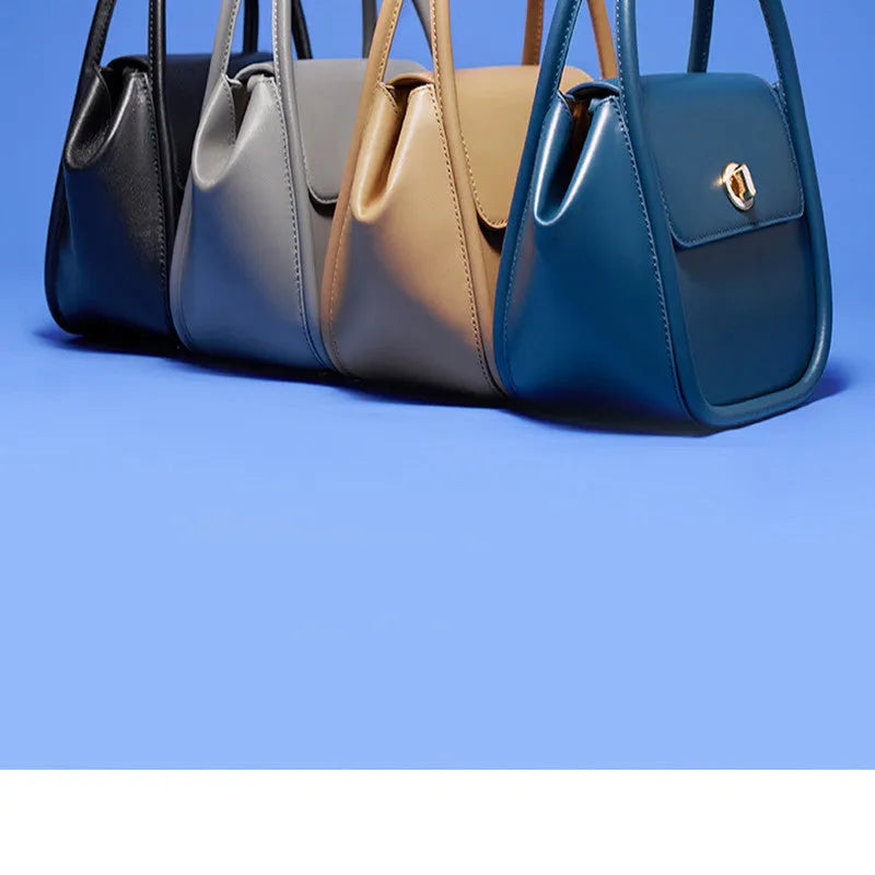 Women's cow leather wing tote bag with shoulder strap and latch closure in four colour options