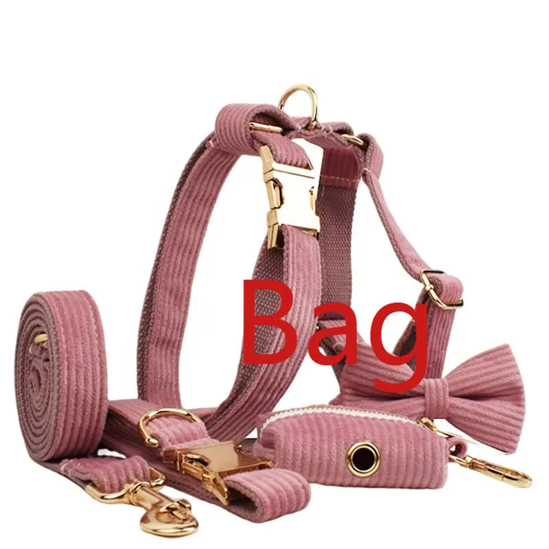 Red corduroy dog collar and matching traction rope set with vest, bow, and poop bag accessories