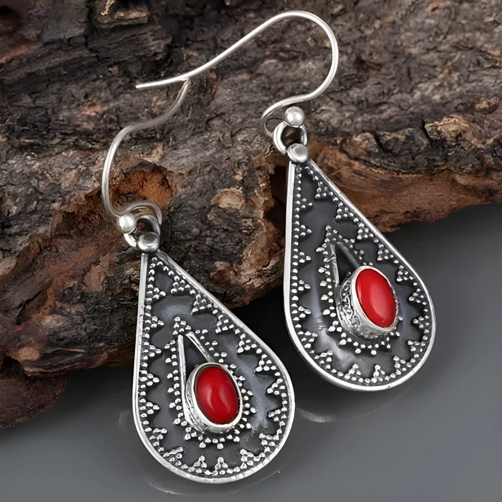 Silver drop-shaped retro earrings for women with red pine gemstone details on zinc alloy.