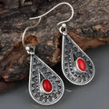 Silver drop-shaped retro earrings for women with red pine gemstone details on zinc alloy.