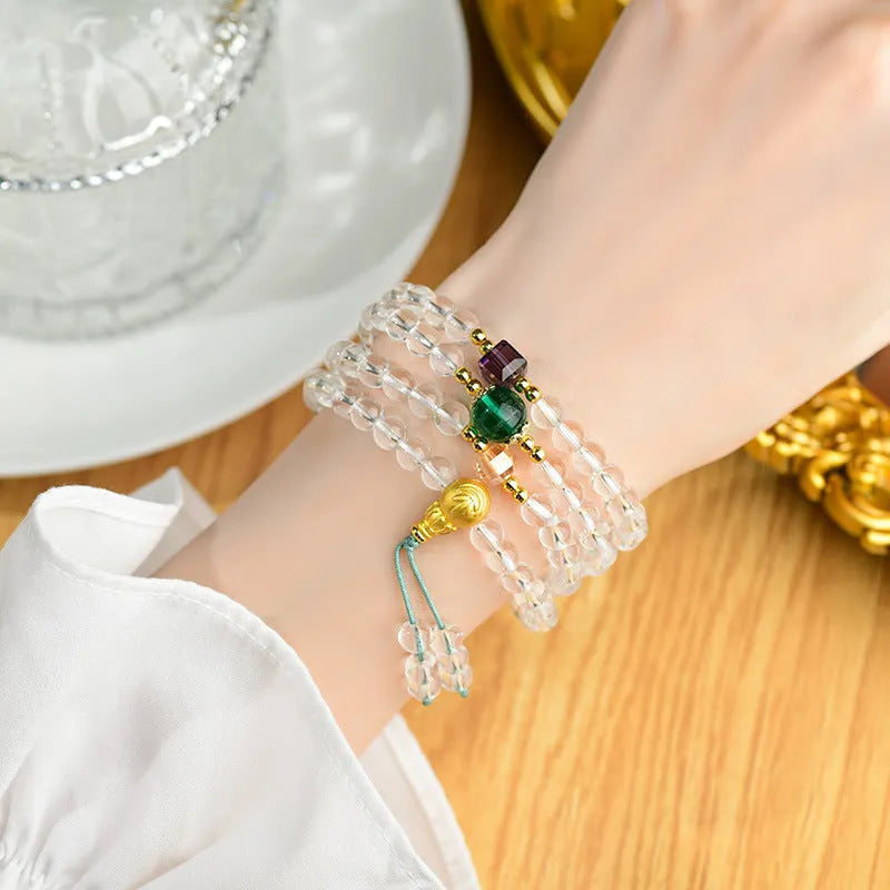 White crystal geometric bead 108 rosary bracelet laid flat, showcasing its unisex ethnic style design.