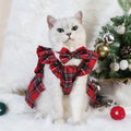 Pet wearing Christmas tartan plaid skirt with matching head flower and bow tie festive costume