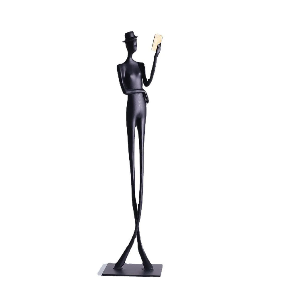 Black cast aluminium desktop sculpture of a reading woman, modern simplicity style