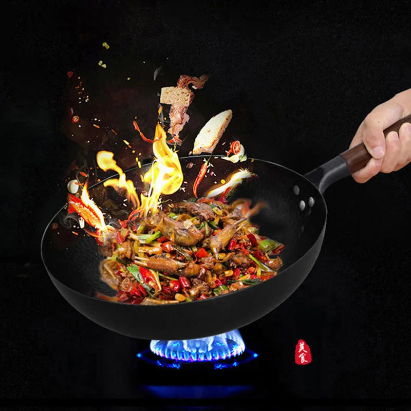 Traditional black iron wok with wooden handle showing 40cm diameter cooking surface