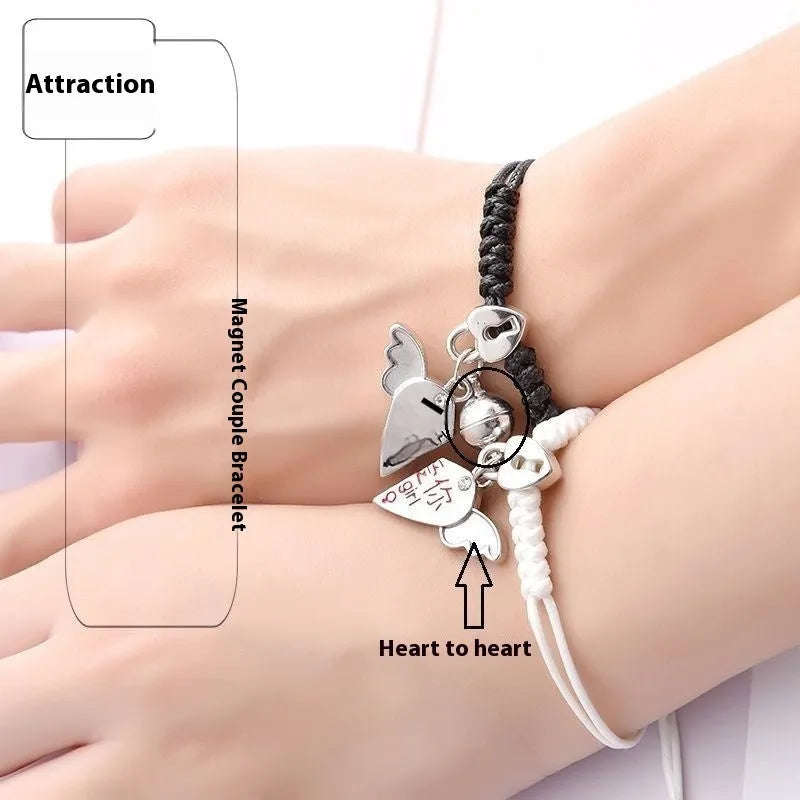 Magnetic couple's alloy bracelet pair with electroplated finish in various designs like crown, cross, and kitten.