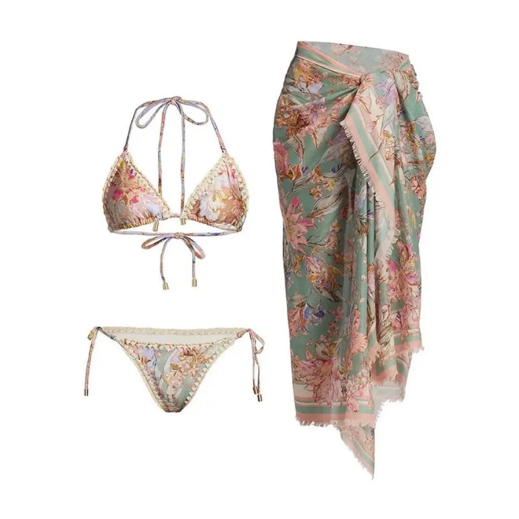 Women's creamy-white floral bikini set with separate skirt on beach