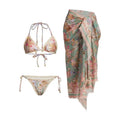 Women's creamy-white floral bikini set with separate skirt on beach