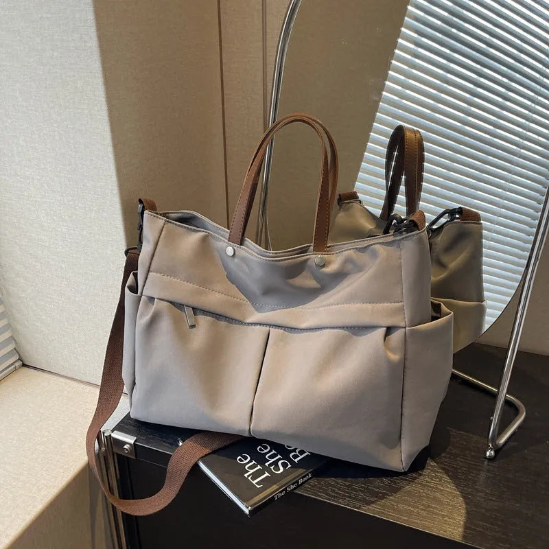 Nylon crossbody tote bag for women in black, grey, white, or green, showing 39x14x28 cm dimensions