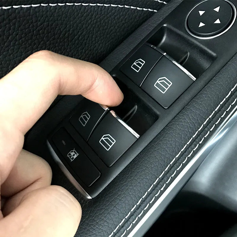 Black glitter decorative sticker for car window lift button panel on door.