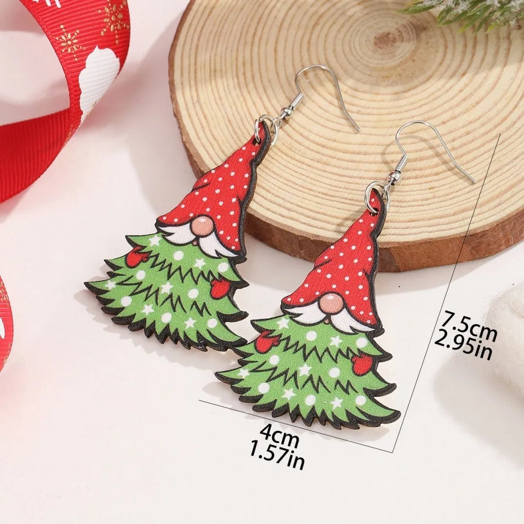 Wooden Christmas earrings with printed geometric designs featuring Christmas tree and snowman patterns