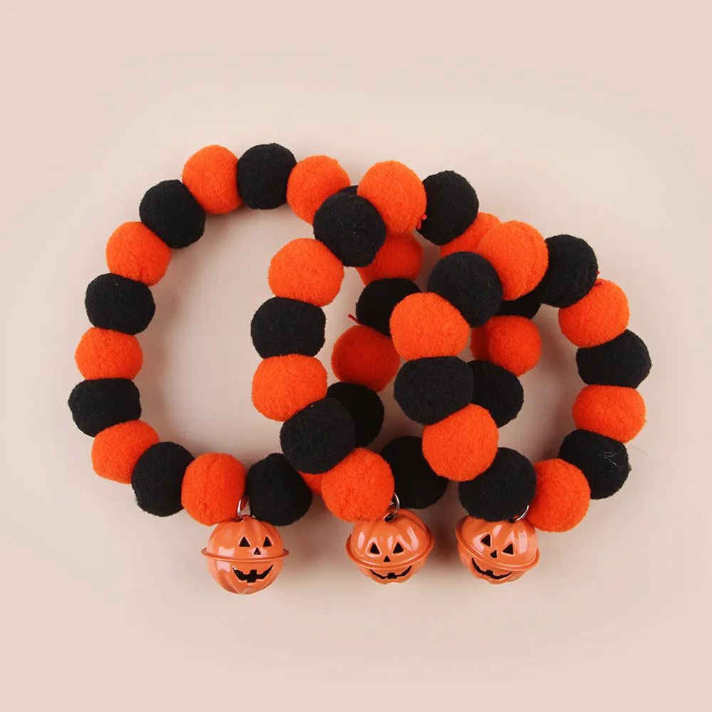 Black Halloween cat collar with pumpkin decoration on adjustable strap