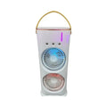 White portable humidifier fan with two spray heads, remote control, and coloured LED lights on a desk.