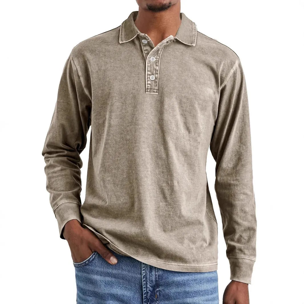 Man wearing a retro washed army green long sleeve polo shirt with a lapel collar and distressed detailing.