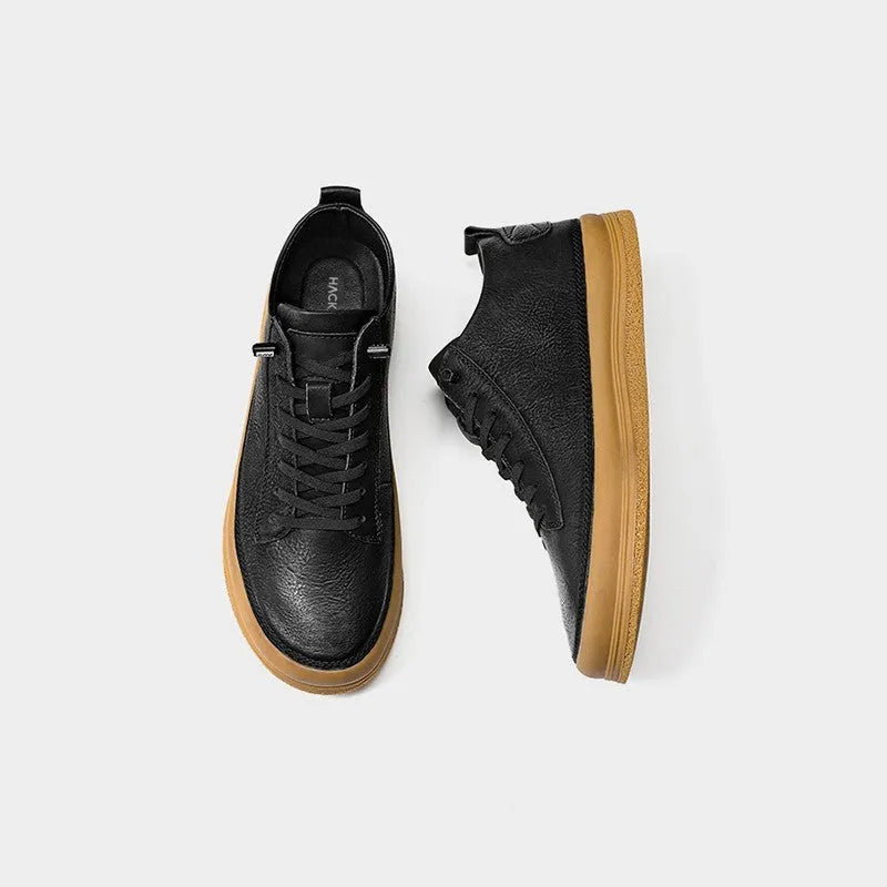 Men's black casual leather shoes with round toe and rubber soles displayed alongside white colour option
