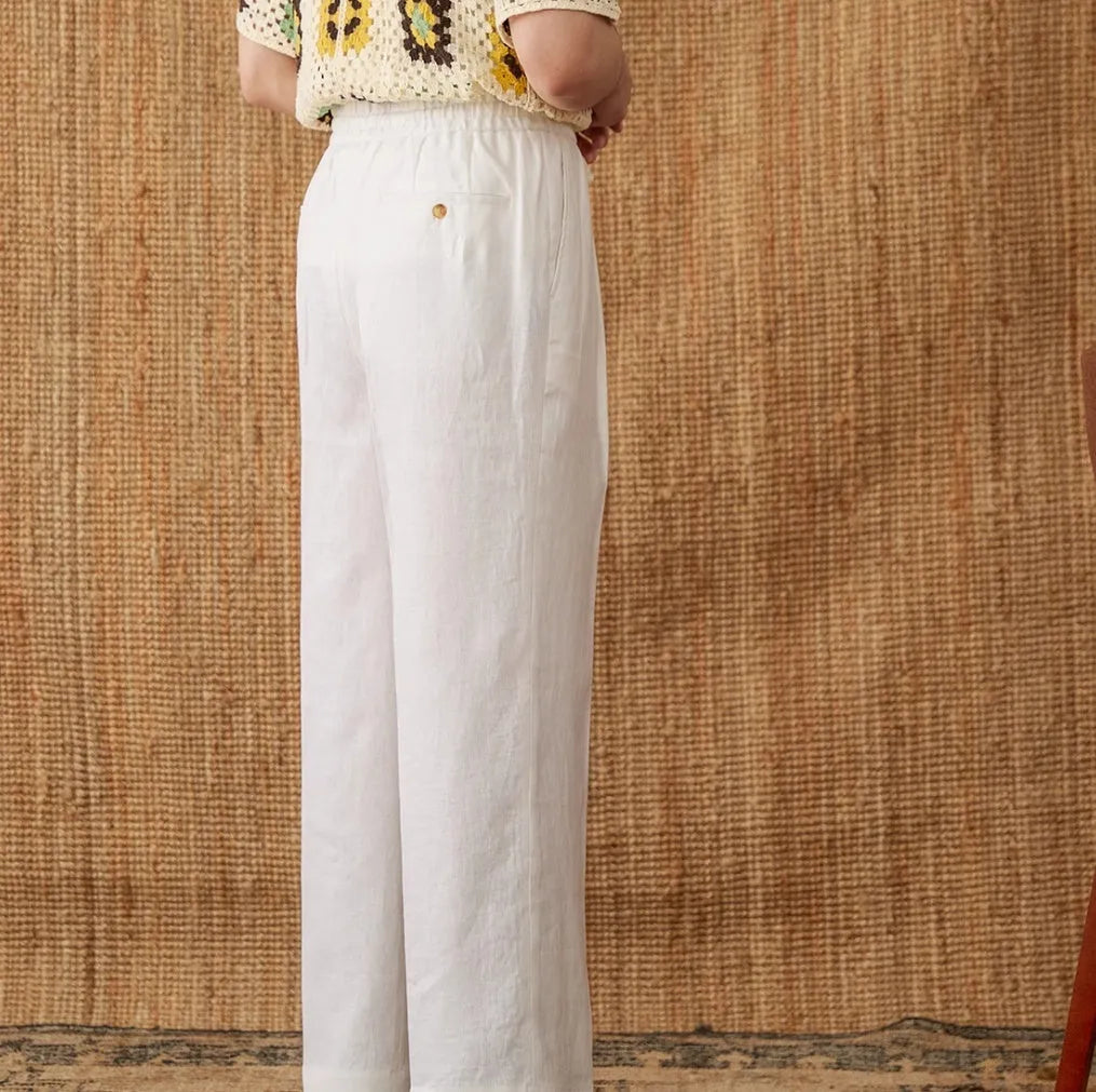 Women's straight-leg linen trousers in high waist design with elasticated back, shown in greige colour.