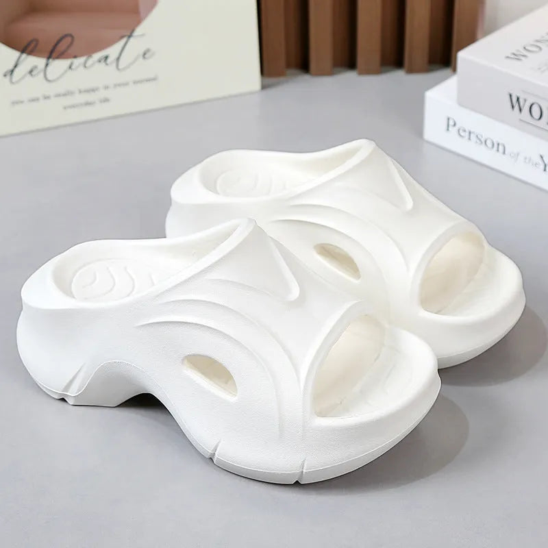 Women's thick-soled EVA foam slippers in white, black, and rose red colours with round toe design