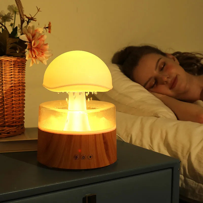 White rain cloud humidifier with falling raindrop effects and LED lighting