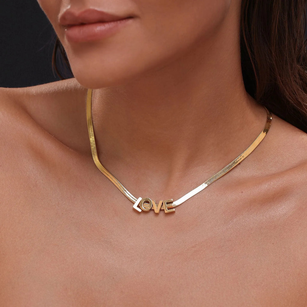 Gold electroplated titanium steel necklace with letter A pendant on a 40cm blade chain