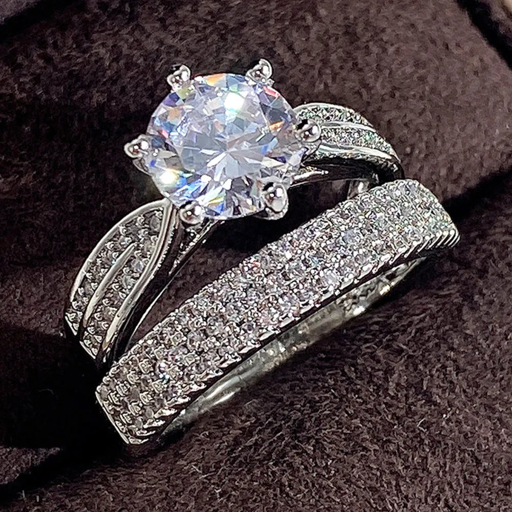 White gold geometric combined wedding ring and simple bracelet on size display.