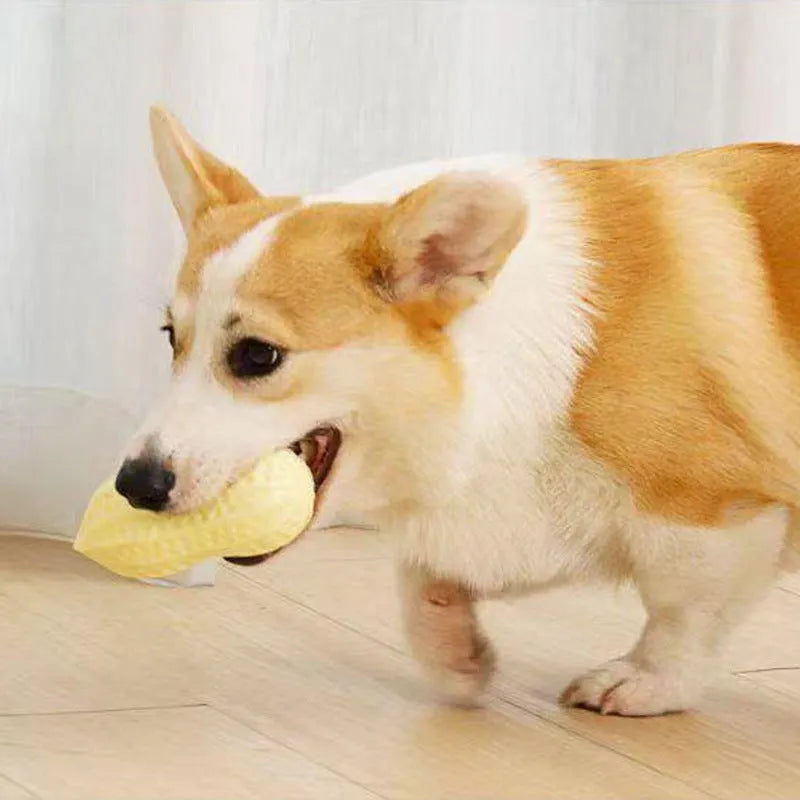 Yellow TPR peanut-shaped dog chew toy with textured surface for dental cleaning