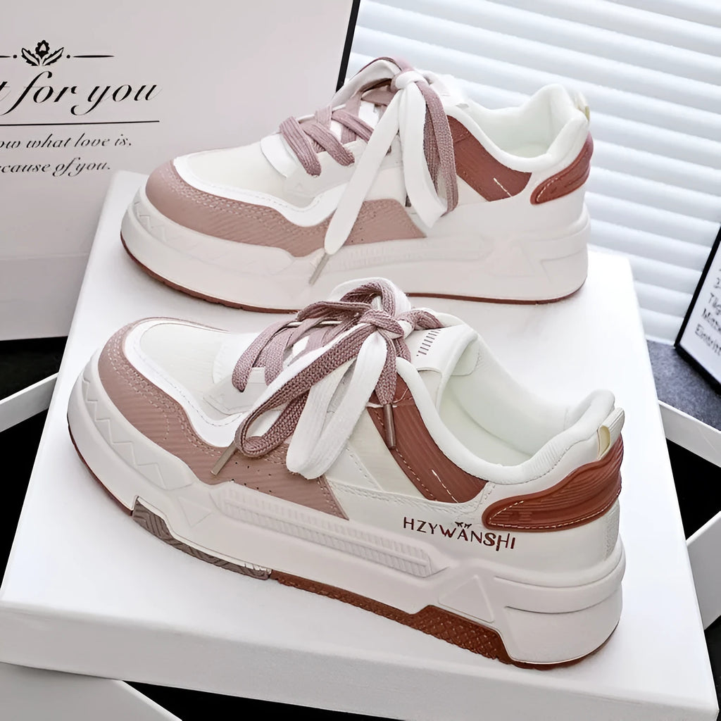 Beige children's board shoes with thick rubber soles, cross shoulder straps, and front laces on a synthetic leather upper.