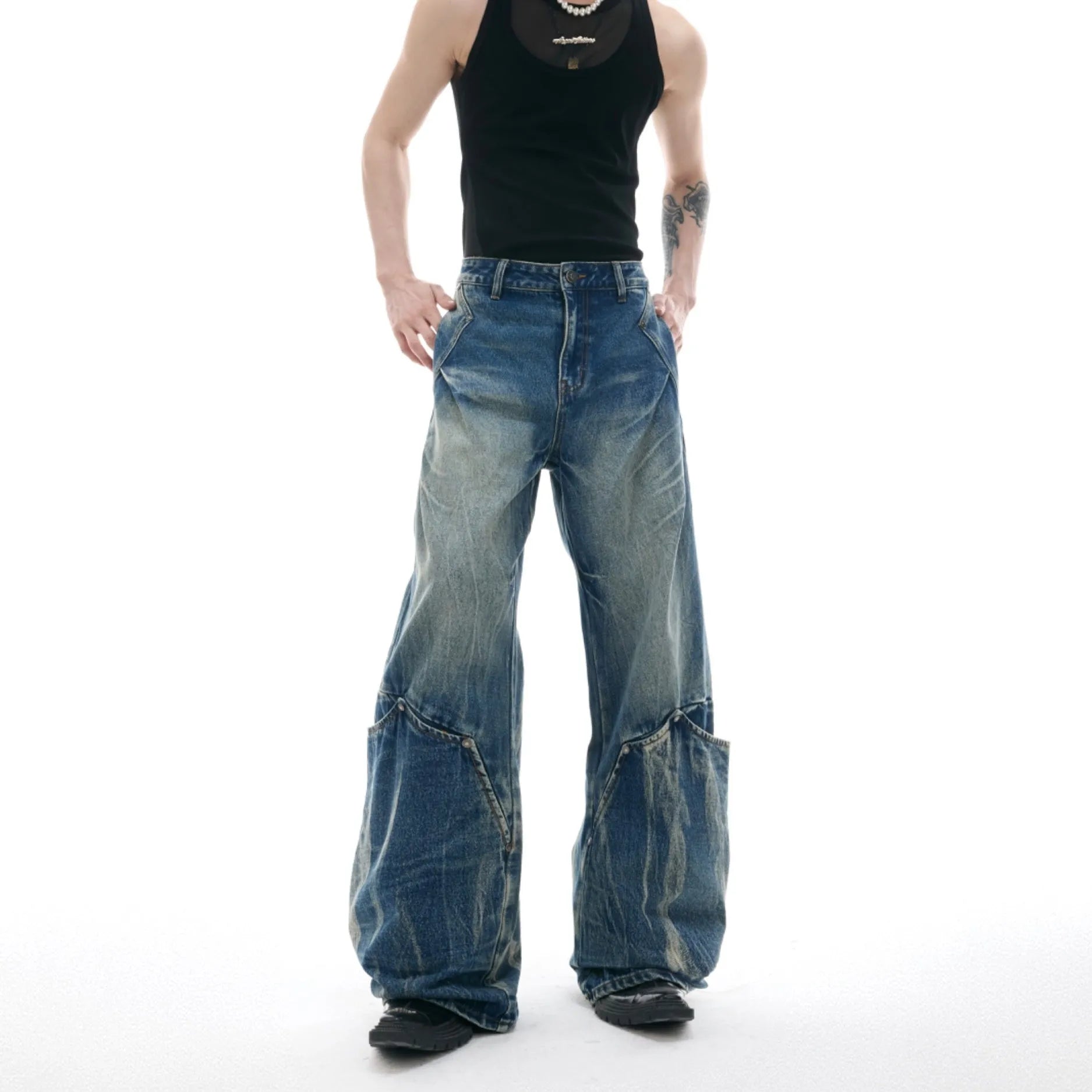 Men's verdant blue loose-fit jeans with a retro washed burst pattern and curved knife design.