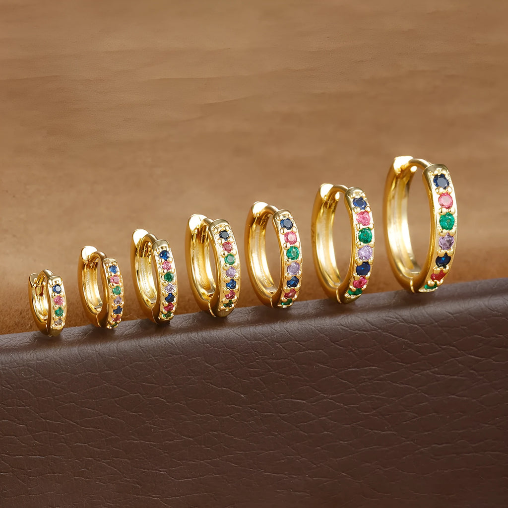 Zircon perforated stud earrings in gold, rose gold, or silver colour with geometric design