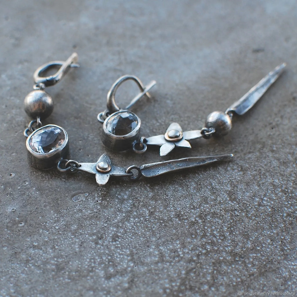 Geometric antique silver pendant earrings with rhinestone accents and long drop design