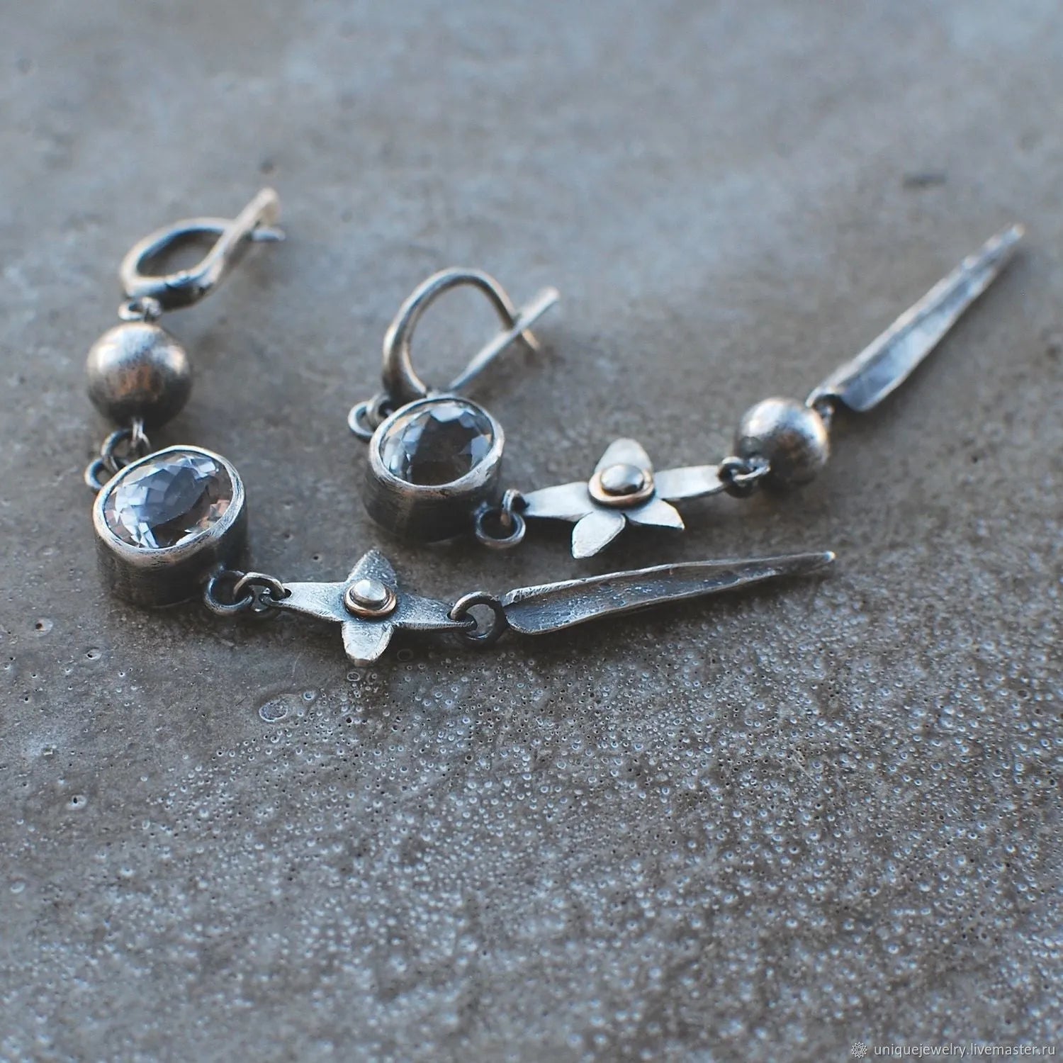 Geometric antique silver pendant earrings with rhinestone accents and long drop design