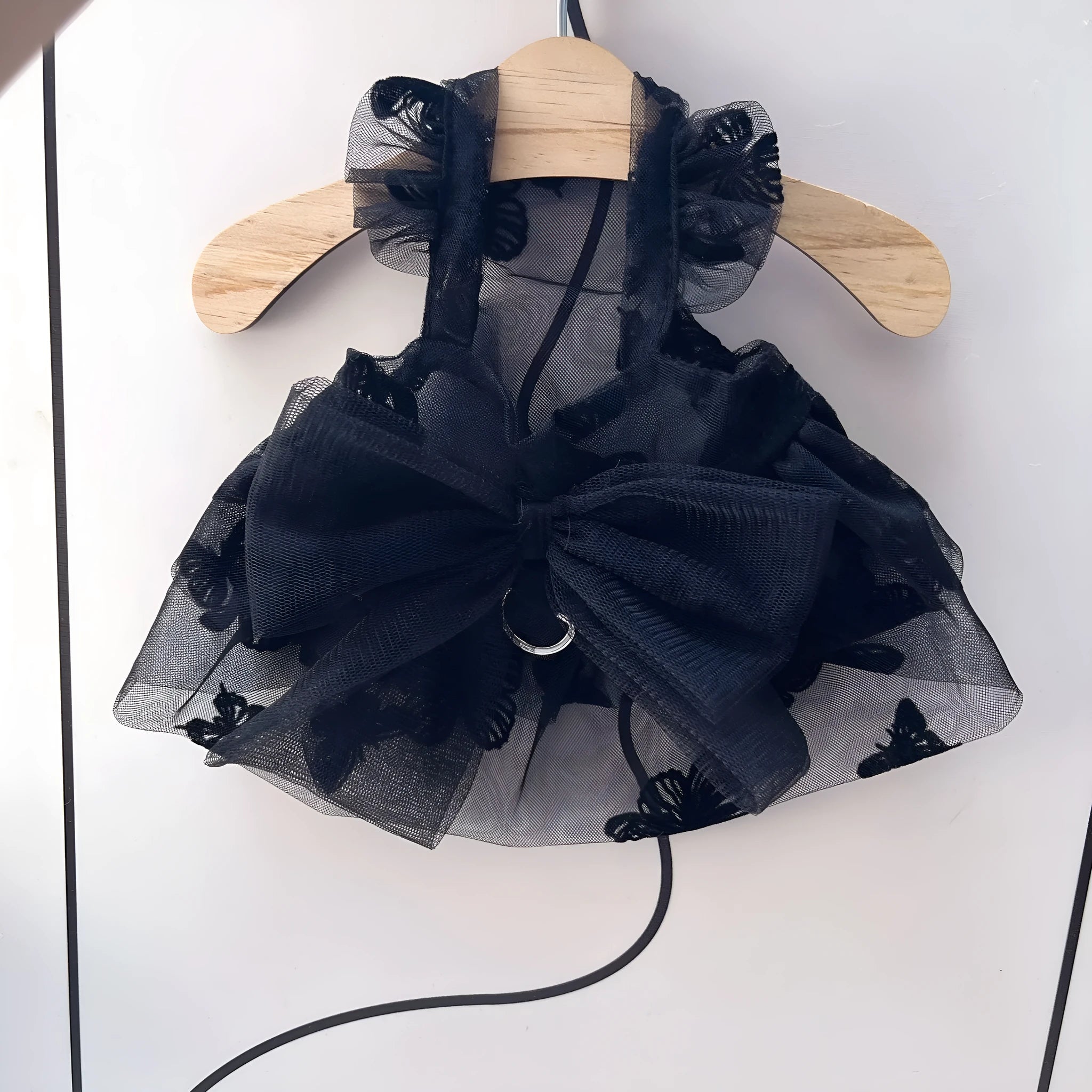 Black gauze princess tulle skirt for a dog or cat on a size chart.