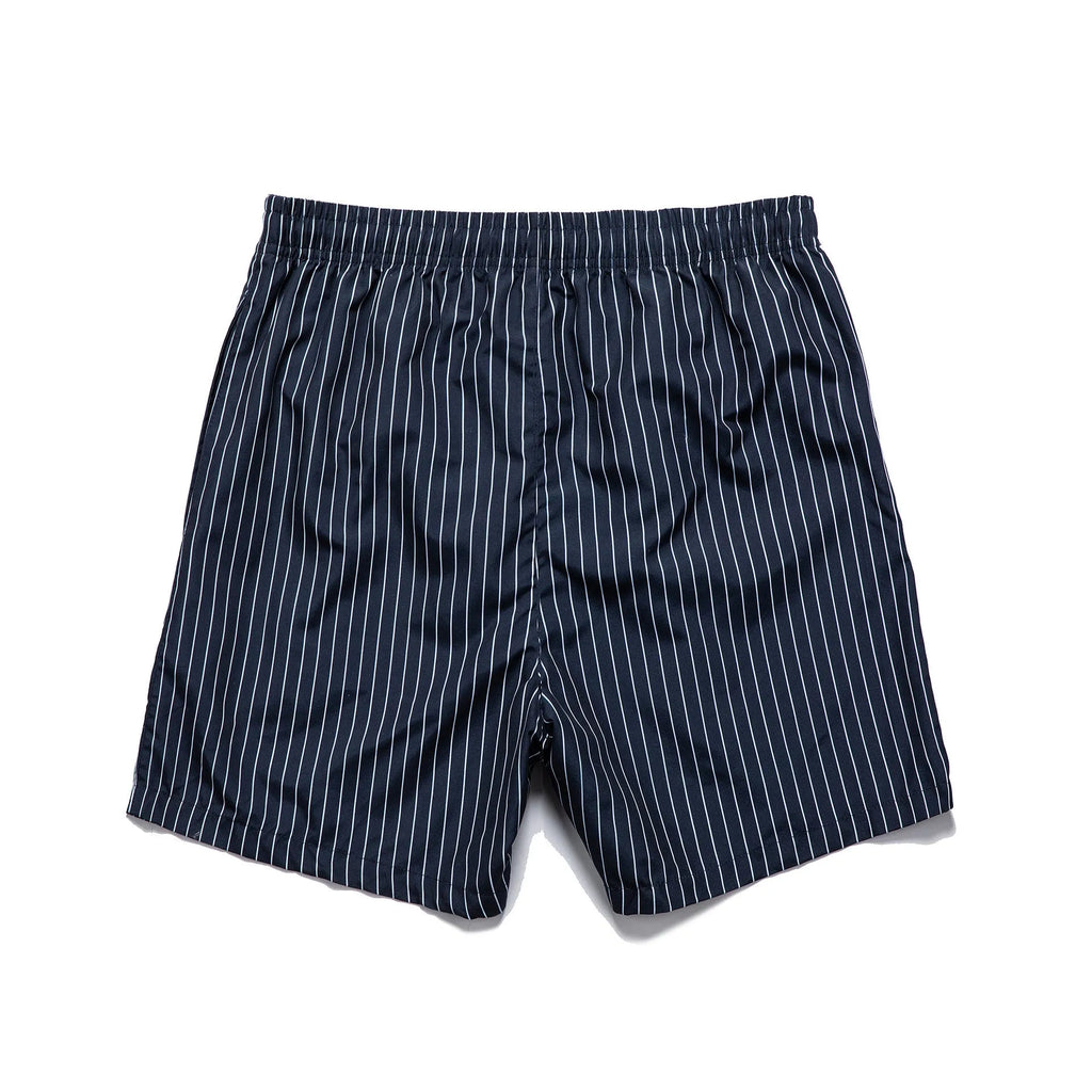 Men's striped polyester shorts in navy blue on a mannequin, showing straight leg design.
