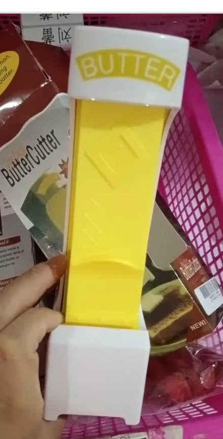 Yellow butter cutter with stainless steel blades for portioning standard butter bars