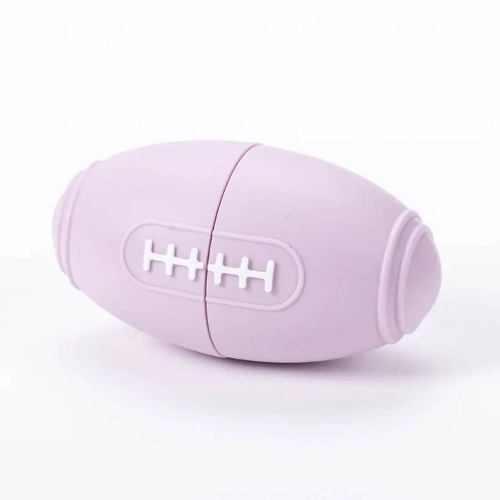 Silicone rugby ball dog toy with treat holes in blue colour