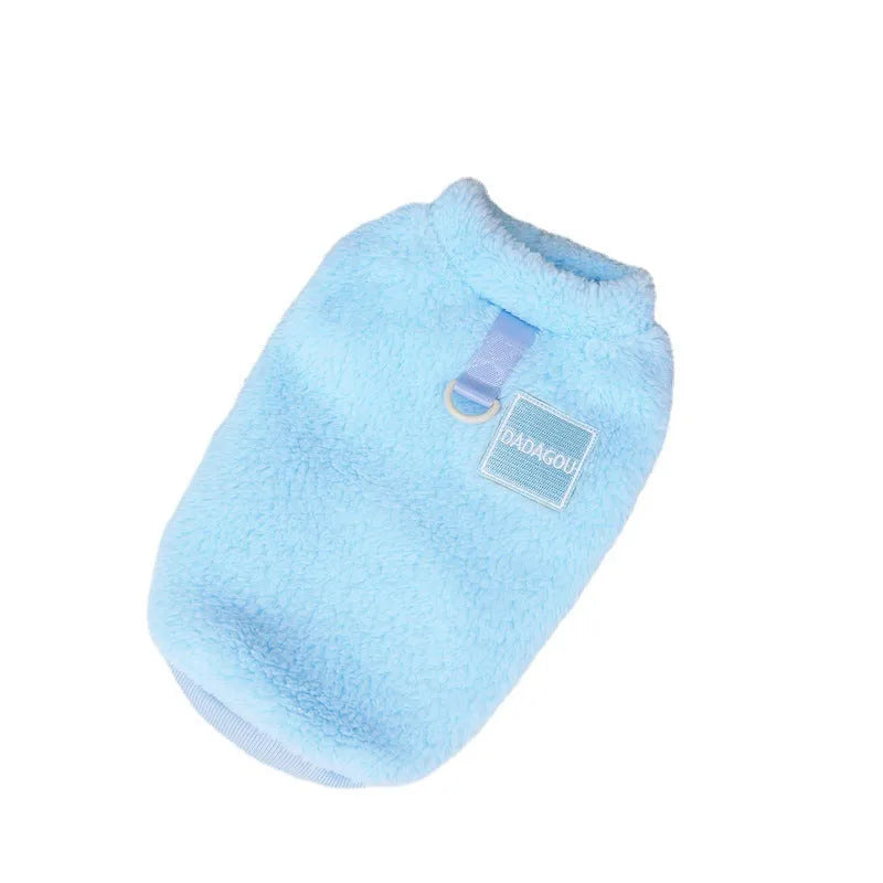 A blue coral fleece pet jacket for dogs or cats with a pull-ring fastening, laid flat.