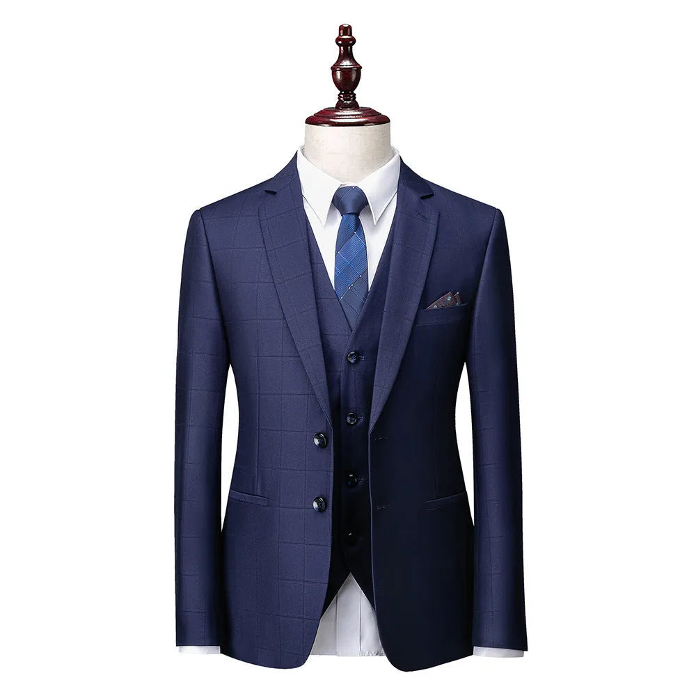 Men's navy blue plaid slim fit three-piece suit with vest, jacket, and trousers on hanger