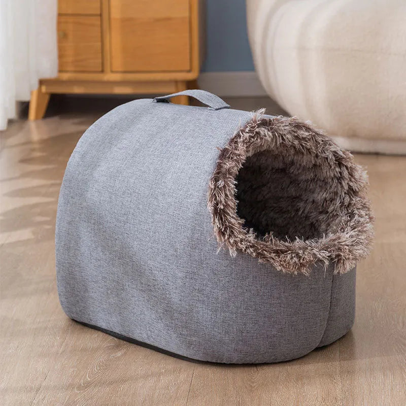 Grey fleece-lined enclosed cat sleeping bag nest showing closed design with warm interior