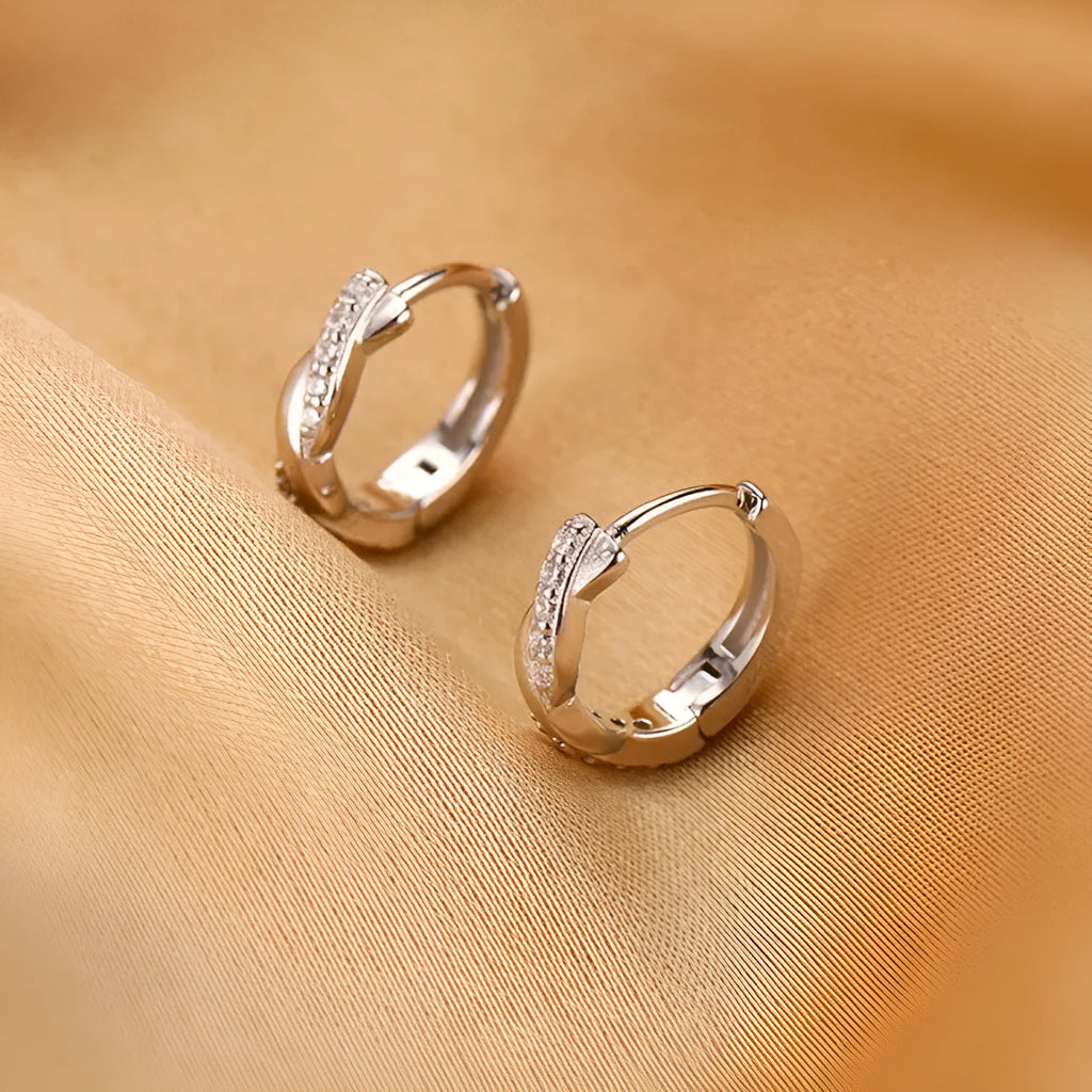 Geometric interwoven hemp rope earclip earrings in gold or silver colour on a copper base.