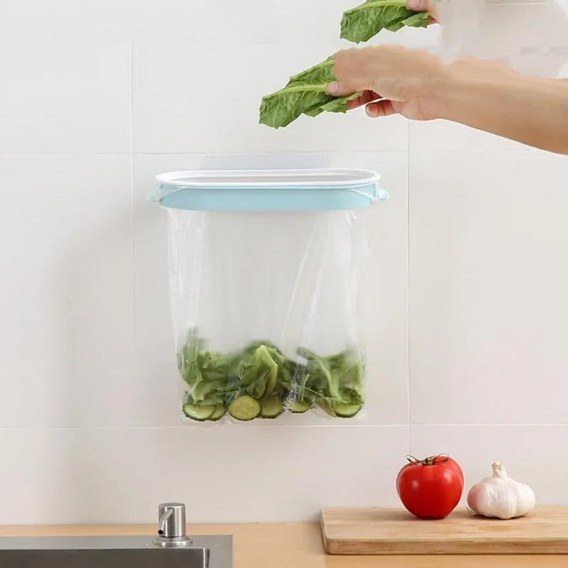 Blue or pink plastic kitchen garbage bag storage rack mounted to cabinet