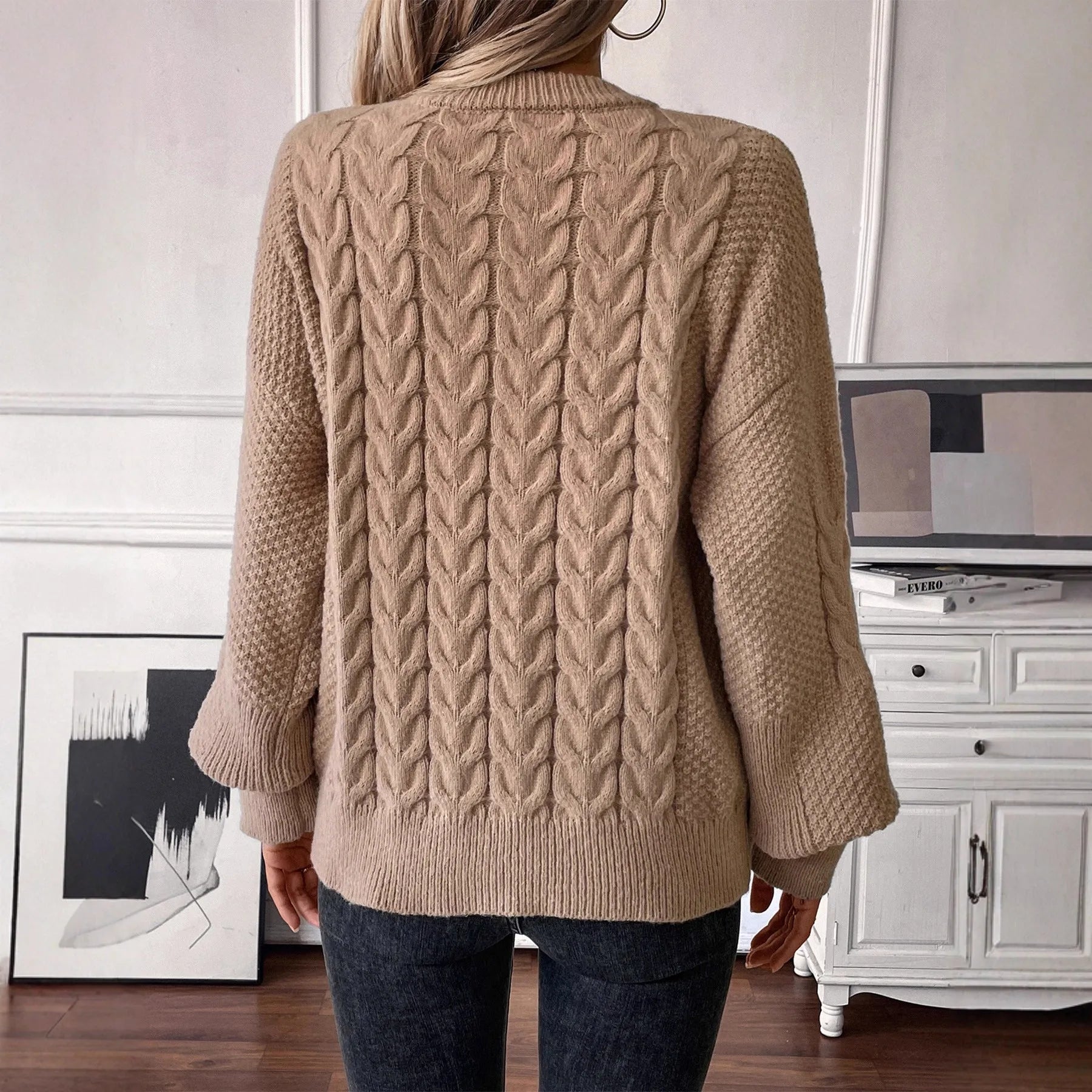 Women's beige casual sweater with a textured twist design and round neck.