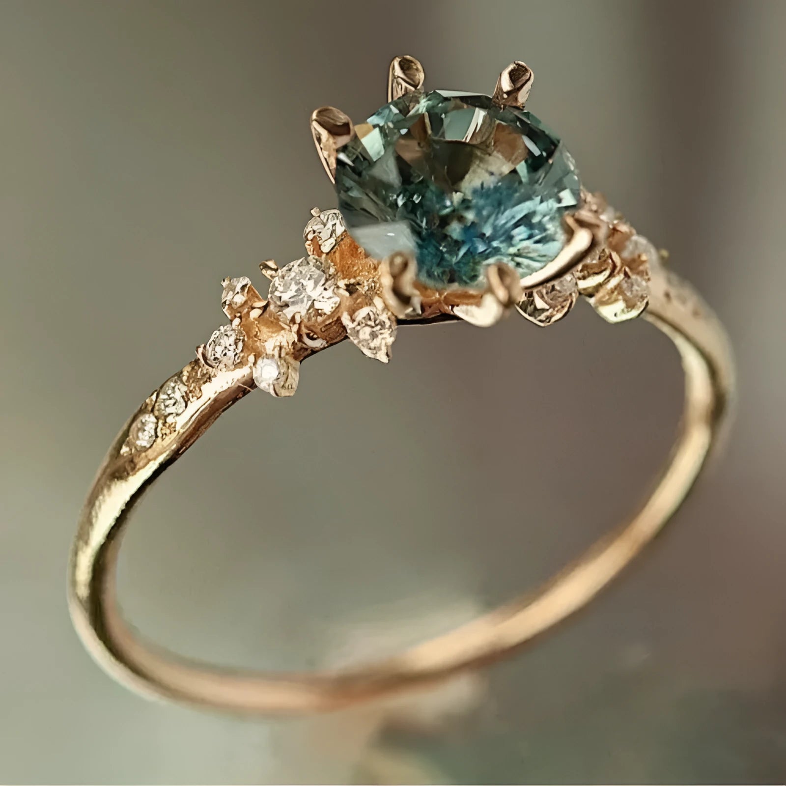 Geometric gold plated claw ring with square pattern and zircon detailing shown in unisex sizes 6-10