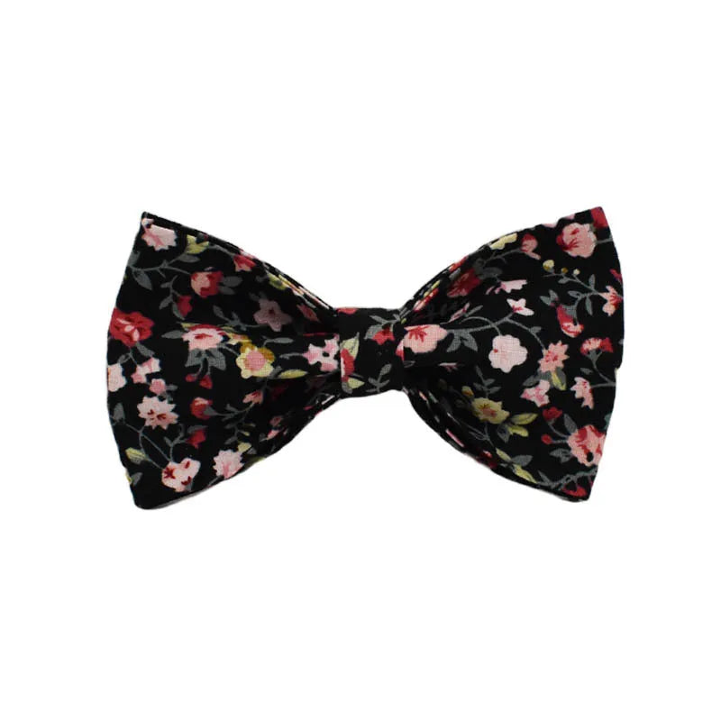 Four-piece pet accessory set showing dog collar, matching leash, decorative bow, and dog vest with cute printed lettering