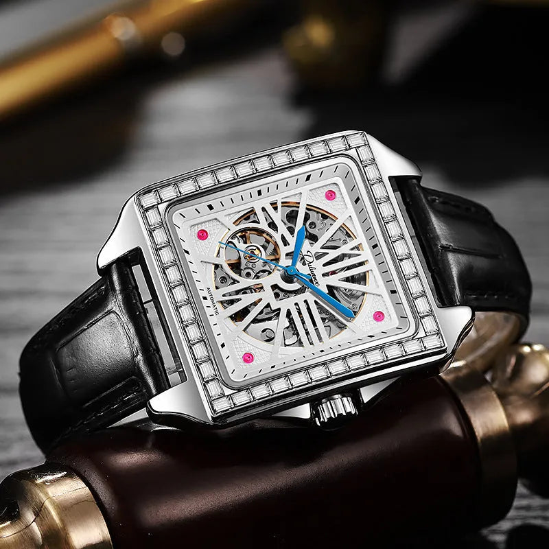 Men's square-faced automatic watch with diamond studs on a black leather strap