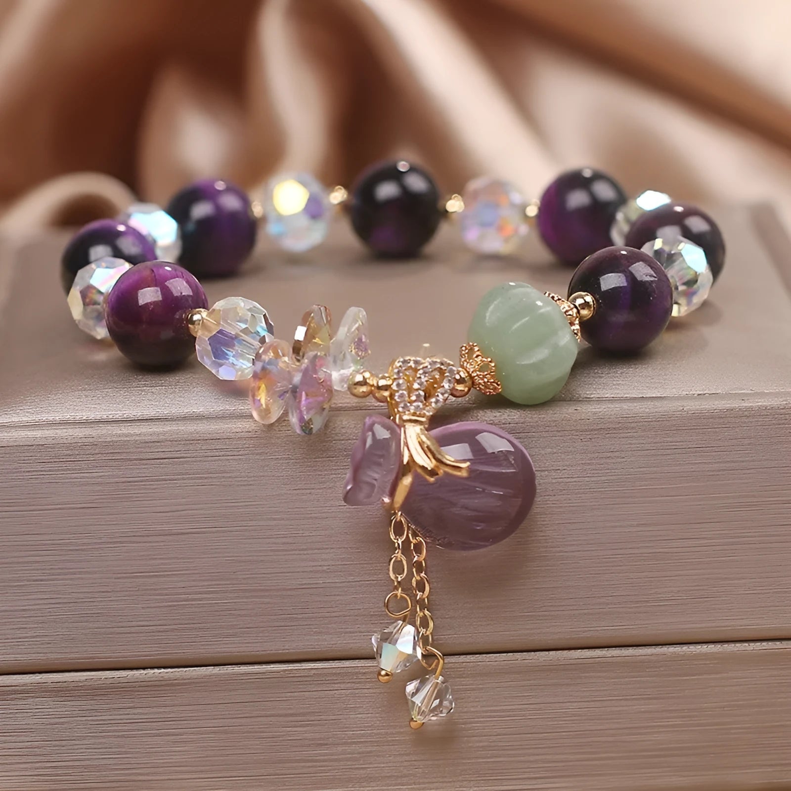 Purple Tigereye money bag pendant transport bracelet with crystal and rhinestone details