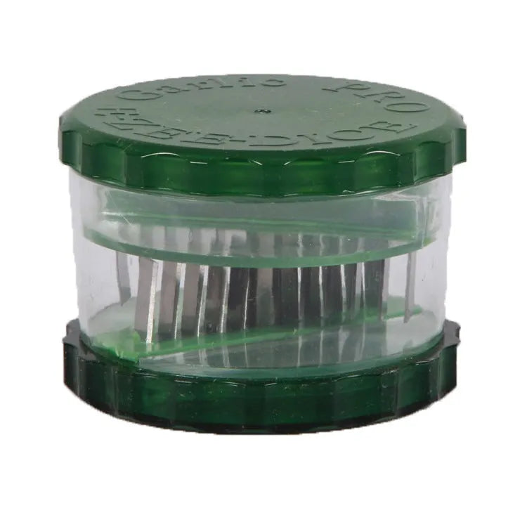 Green transparent polypropylene garlic peeler on a kitchen counter