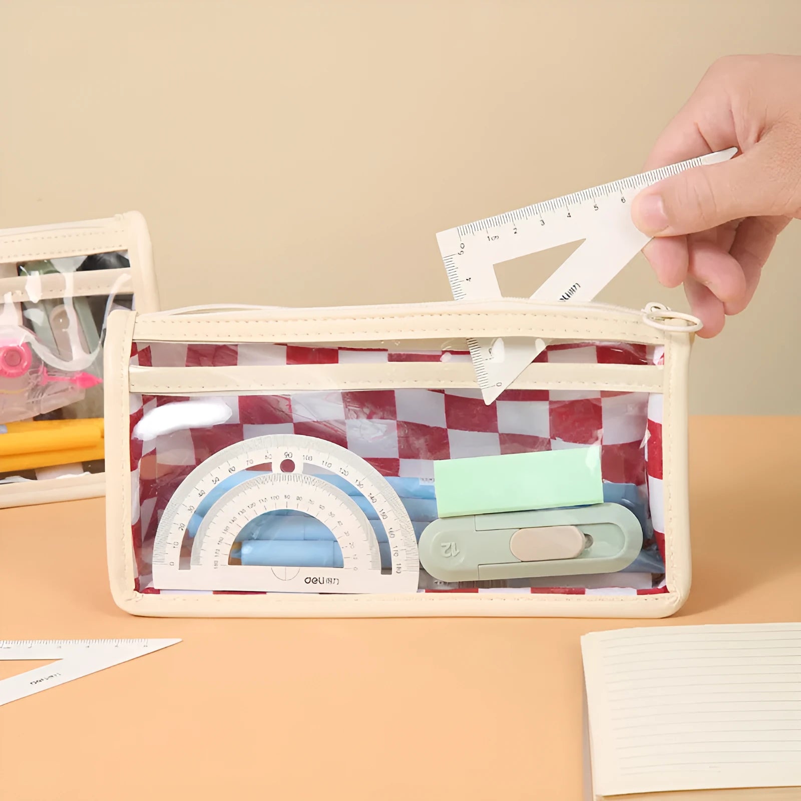 Chessboard pattern transparent PVC pencil case showing black and white grid design