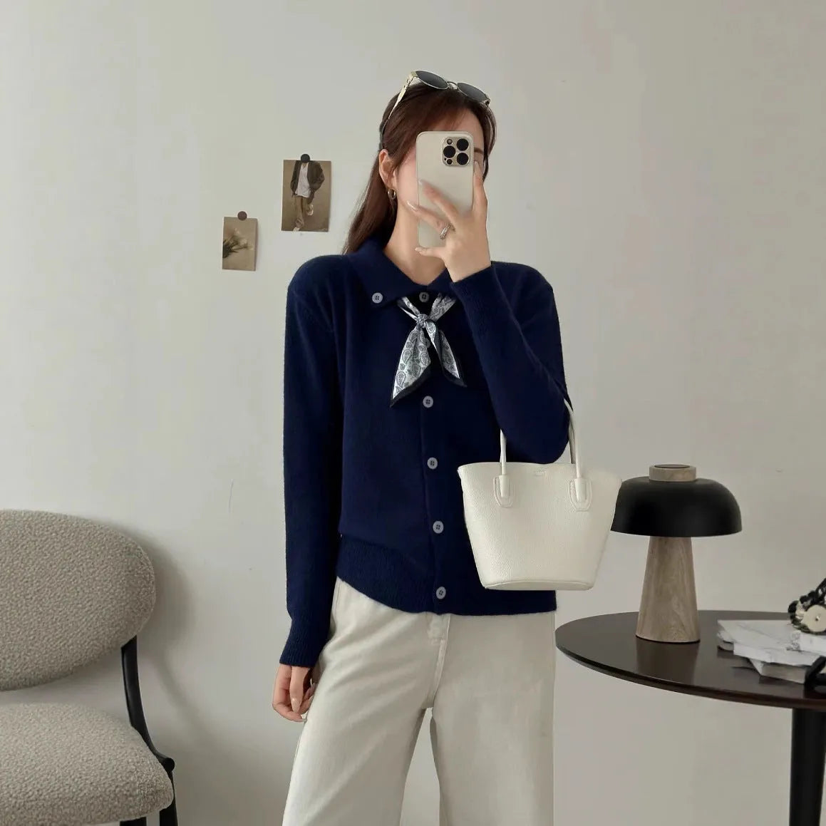 Acrylic fibre lazy fashion cardigan sweater with integrated lapel scarf in a neutral colour.