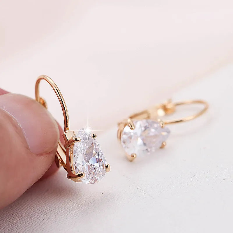 Gold and platinum drop-shaped women's metal earrings with a k-platinum inlaid gem