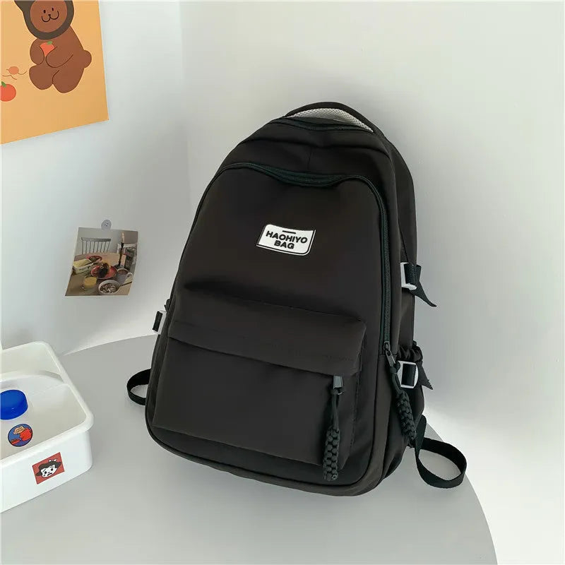 Korean-style lightweight waterproof nylon backpack for primary school students in macaron colour with curved shoulder strap, 20-35L capacity