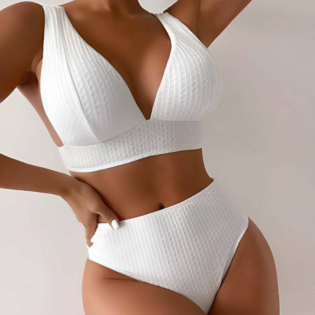 White women's backless two-piece bikini swimsuit set on a mannequin.