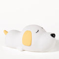 Cute two-tone cartoon dog silicone night lamp with USB cable for charging.